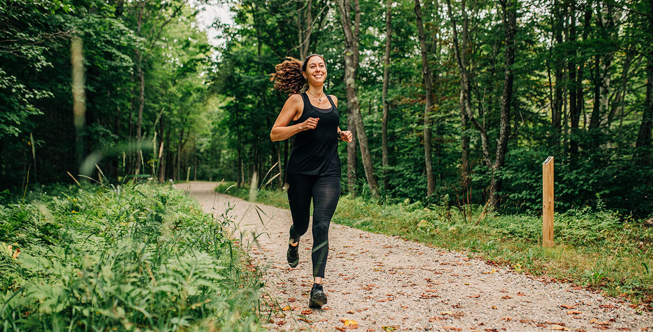 woman running wearing micro weight woolverino tank
