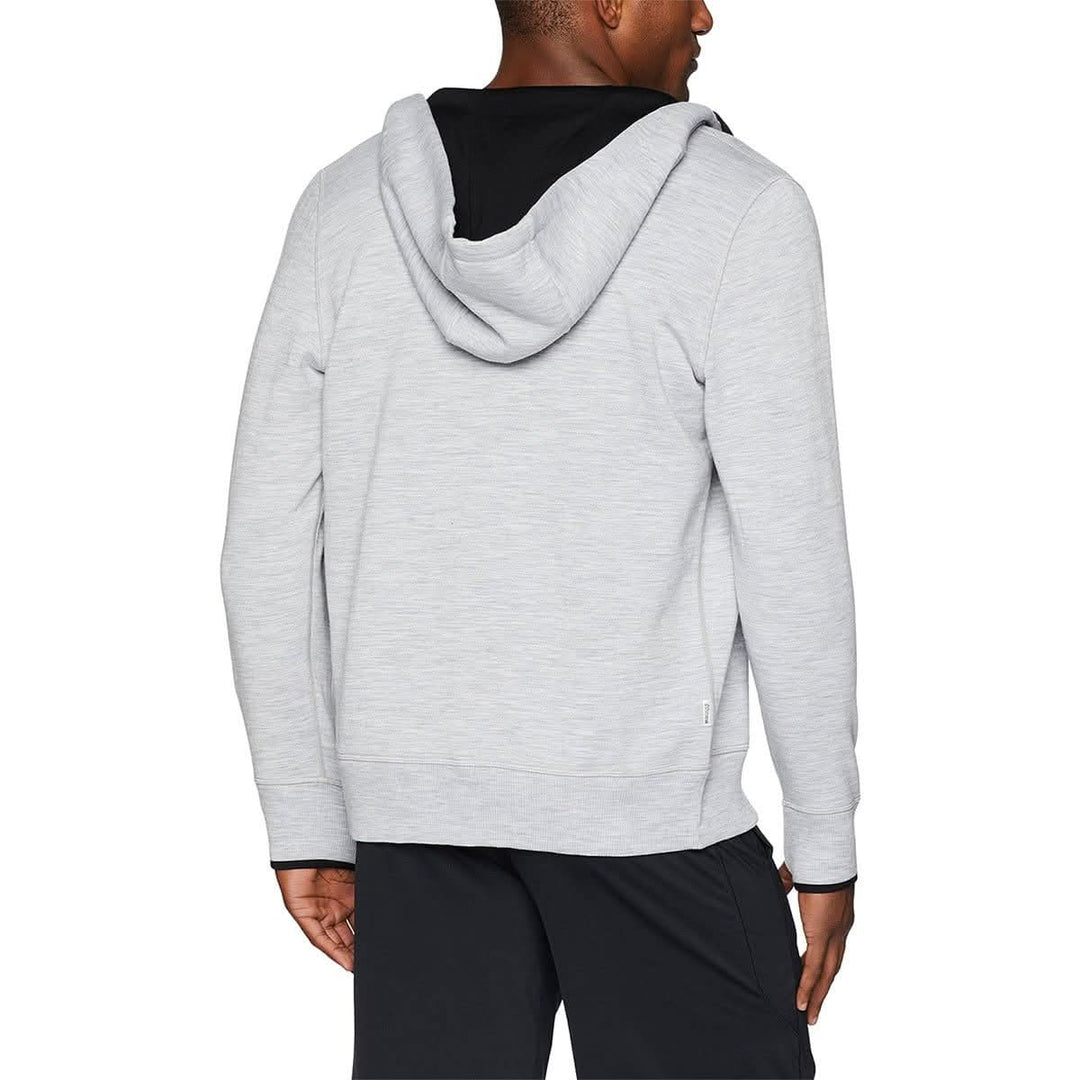 A man models the heavyweight brushed wool Kodiak Fleece Hoodie, crafted with thumbholes and a drawstring to bundle you up for wicked cold days! #color_ash-gray