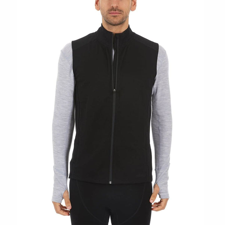 A man models the heavyweight merino wool full-zip vest #color_black
