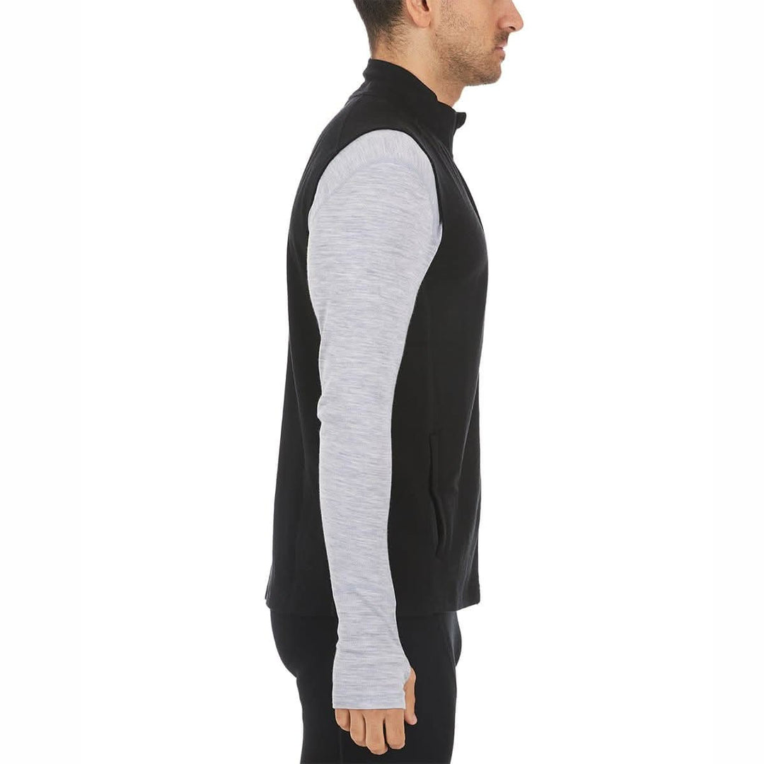 A man models the heavyweight merino wool full-zip vest #color_black