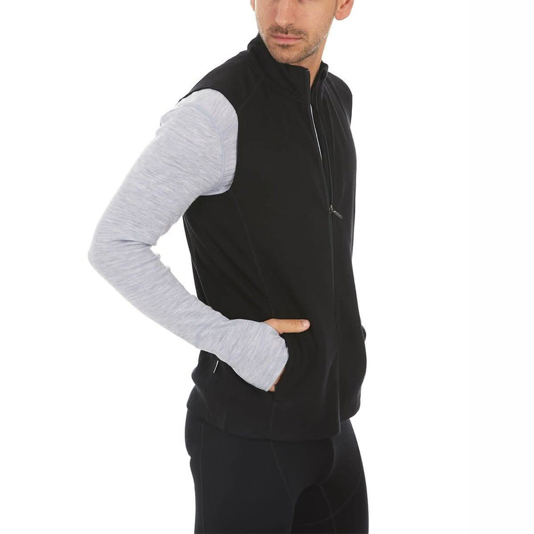 A man models the heavyweight merino wool full-zip vest #color_black