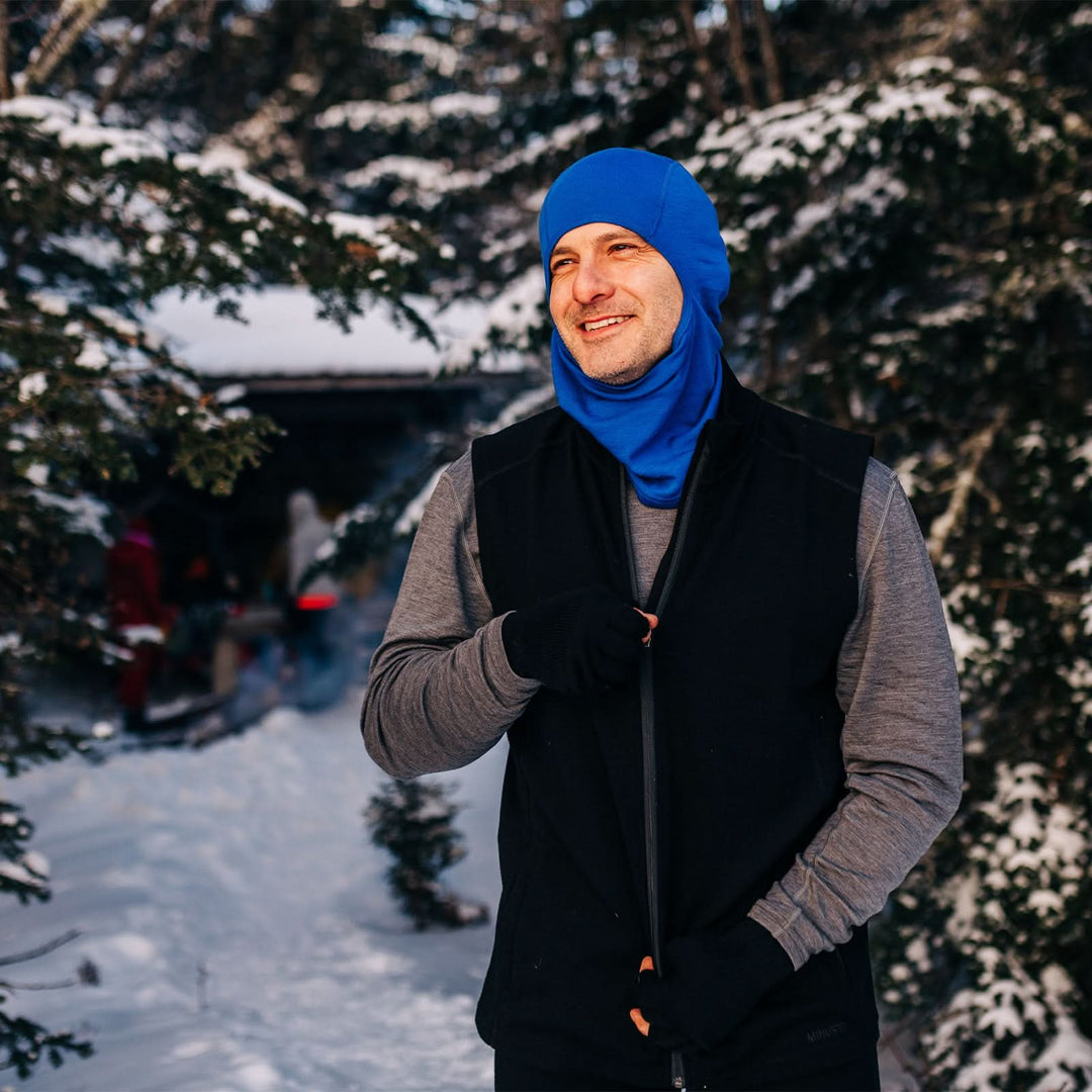A man models the heavyweight merino wool full-zip vest #color_black