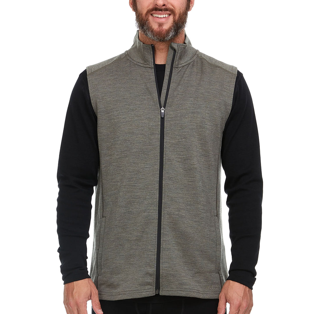 A man models the heavyweight merino wool full-zip vest #color_granite-green