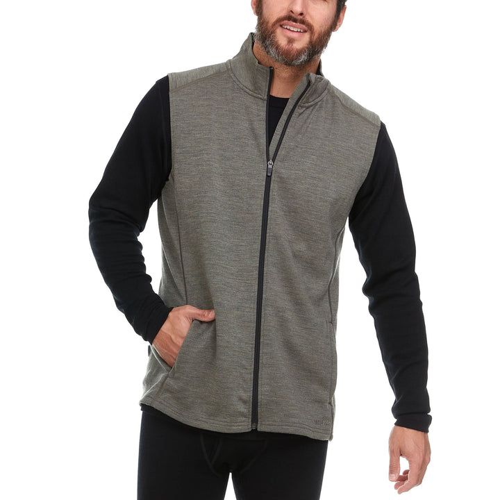 A man models the heavyweight merino wool full-zip vest #color_granite-green