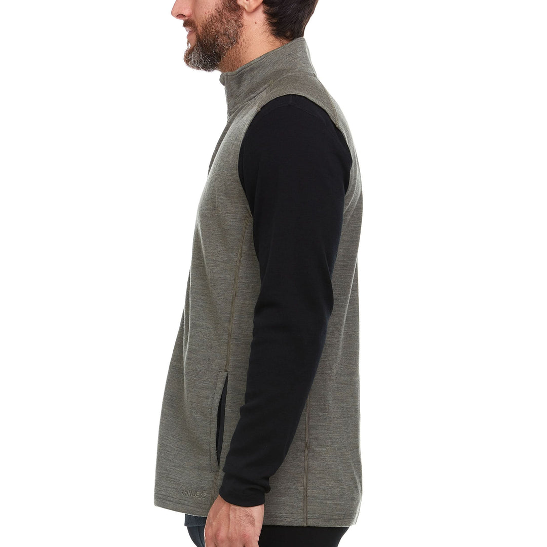 A man models the heavyweight merino wool full-zip vest #color_granite-green