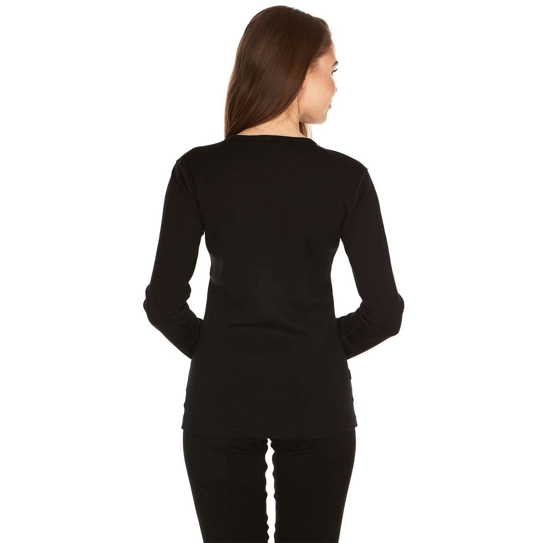A woman models the one hundred percent merino wool heavyweight women's base layer crew top. This super soft top has a princess cut style for a more flattering fit. #color_black