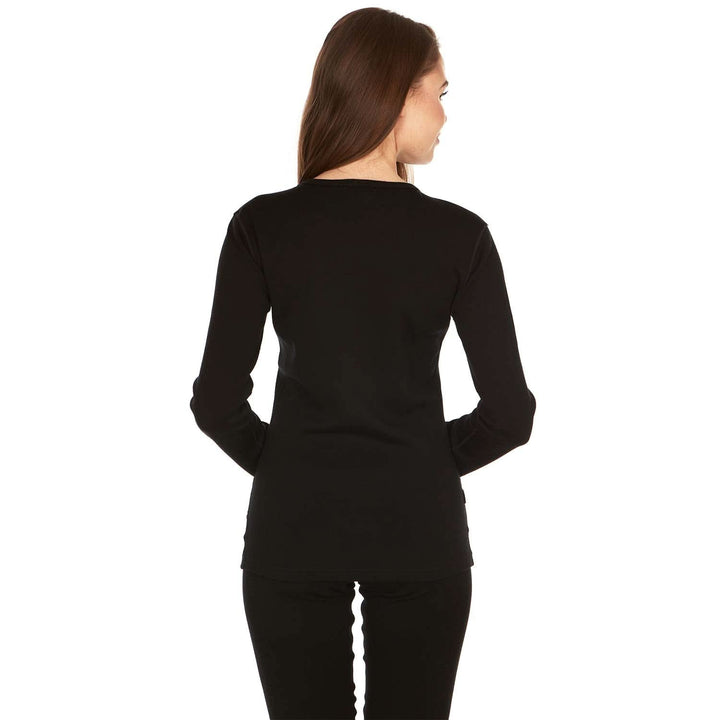 A woman models the one hundred percent merino wool heavyweight women's base layer crew top. This super soft top has a princess cut style for a more flattering fit. #color_black