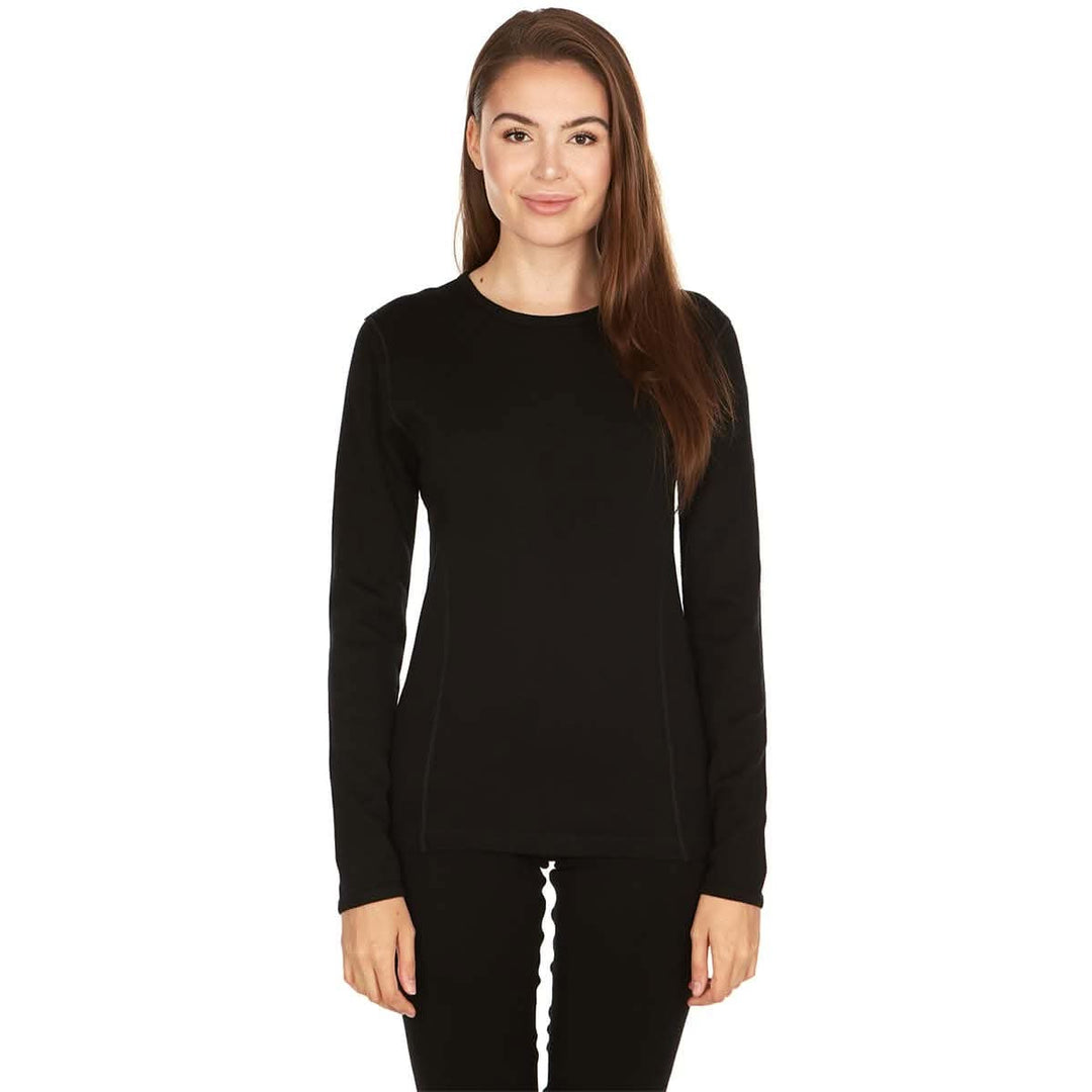 A woman models the one hundred percent merino wool heavyweight women's base layer crew top. This super soft top has a princess cut style for a more flattering fit. #color_black
