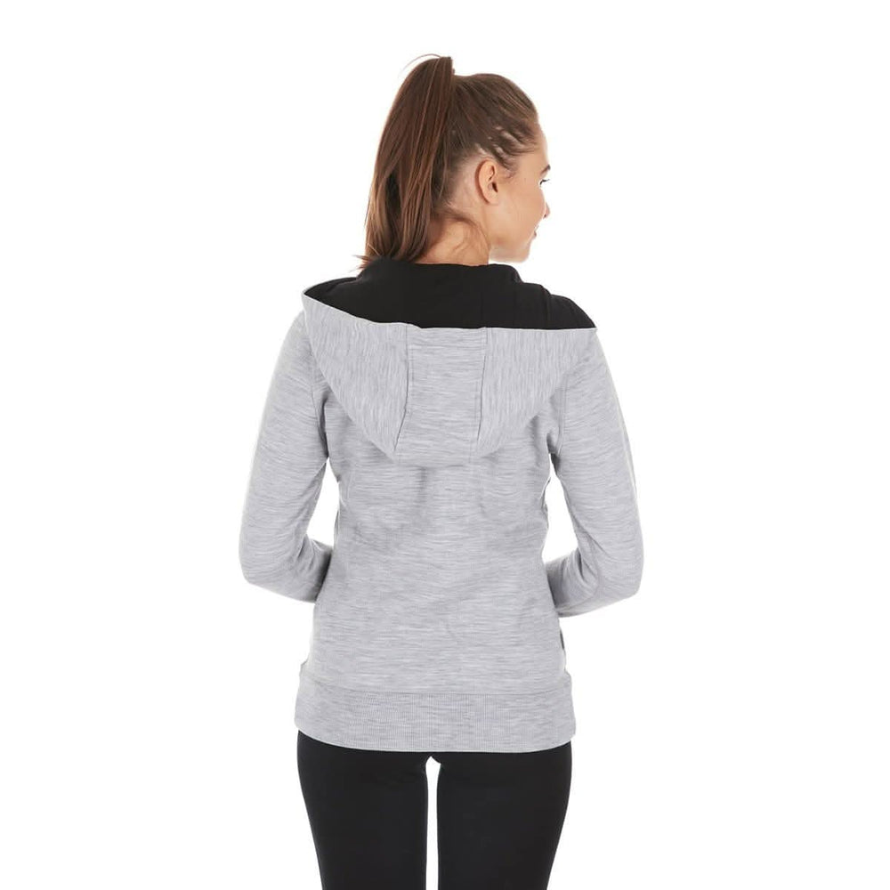 A woman models the heavyweight merino wool brushed fleece hoodie. The hoodie features a large hood with drawstrings, thumbholes, two pockets, and an interior stash pocket inside. #color_ash-gray