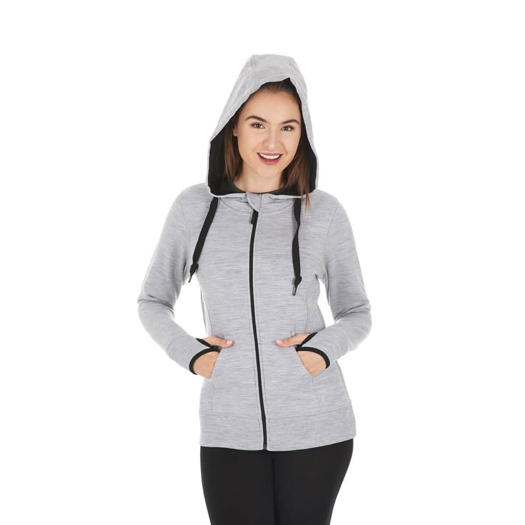 A woman models the heavyweight merino wool brushed fleece hoodie. The hoodie features a large hood with drawstrings, thumbholes, two pockets, and an interior stash pocket inside. #color_ash-gray