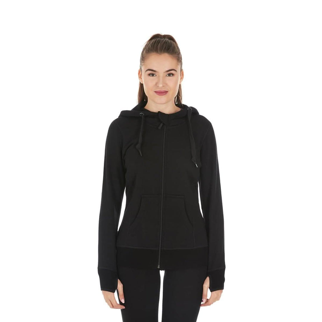 A woman models the heavyweight merino wool brushed fleece hoodie. The hoodie features a large hood with drawstrings, thumbholes, two pockets, and an interior stash pocket inside. #color_black