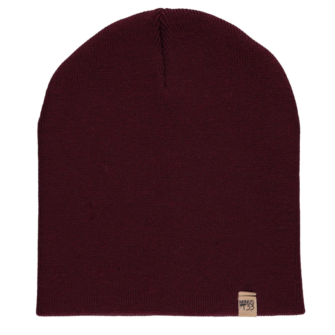 A heavyweight, super soft, one hundred percent merino wool beanie. This heavyweight beanie is the warmest hat that we offer, perfect for hiking through the White Mountains, or sitting at a bonfire in January. #color_burgundy