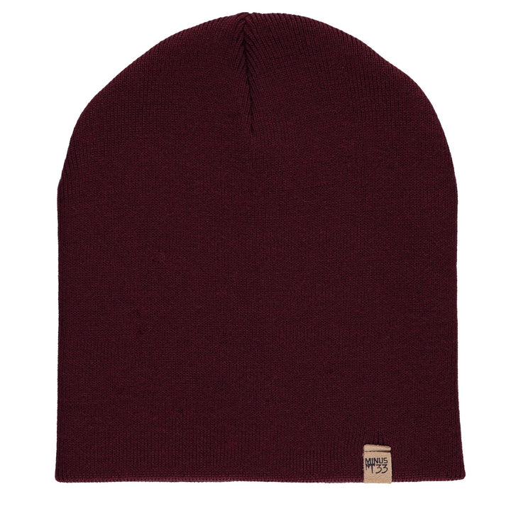 A heavyweight, super soft, one hundred percent merino wool beanie. This heavyweight beanie is the warmest hat that we offer, perfect for hiking through the White Mountains, or sitting at a bonfire in January. #color_burgundy