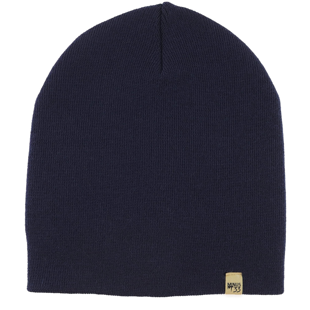 A heavyweight, super soft, one hundred percent merino wool beanie. This heavyweight beanie is the warmest hat that we offer, perfect for hiking through the White Mountains, or sitting at a bonfire in January. #color_navy