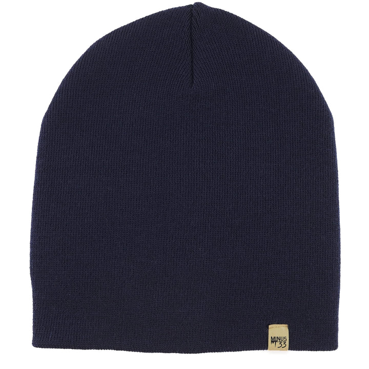 A heavyweight, super soft, one hundred percent merino wool beanie. This heavyweight beanie is the warmest hat that we offer, perfect for hiking through the White Mountains, or sitting at a bonfire in January. #color_navy