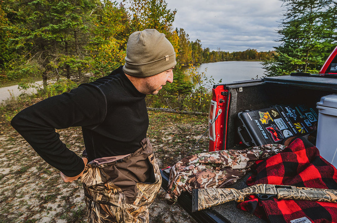 man wearing merino wool beanie and base layer shirt for hunting