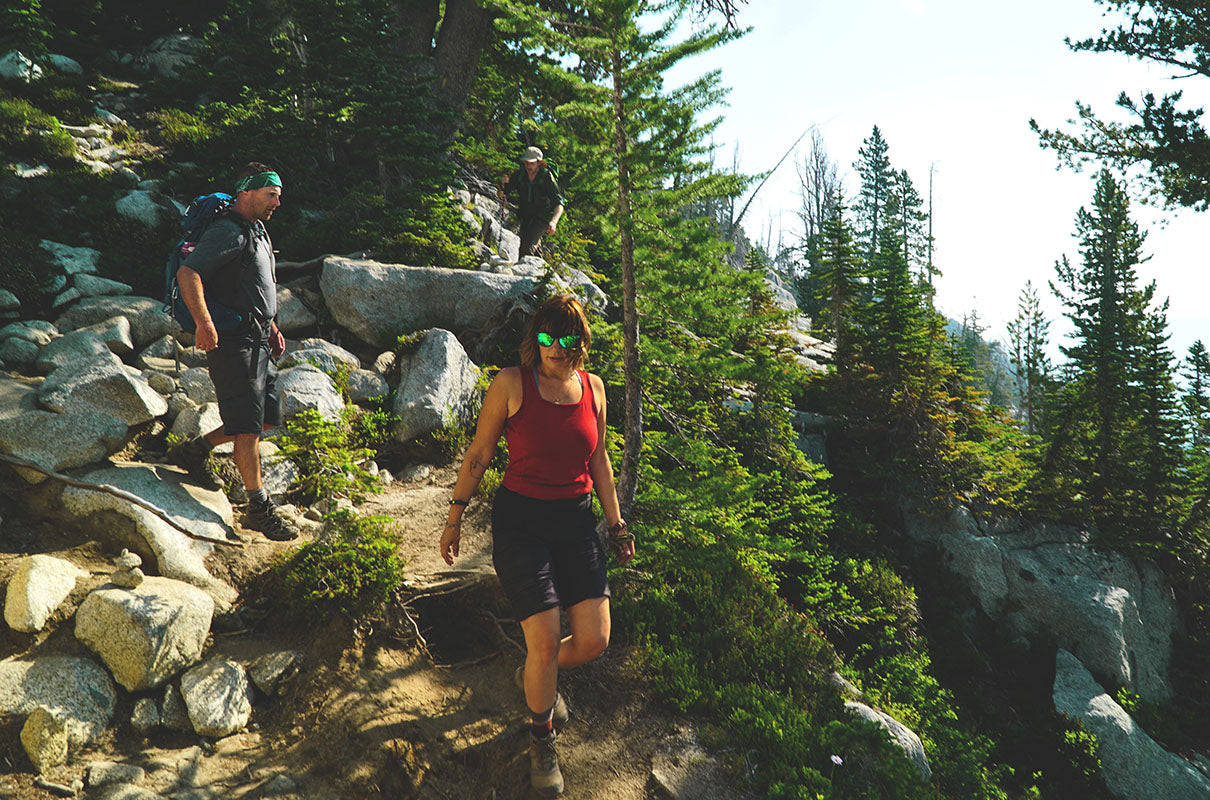 couple hiking wearing merino wool t-shirt and tank top