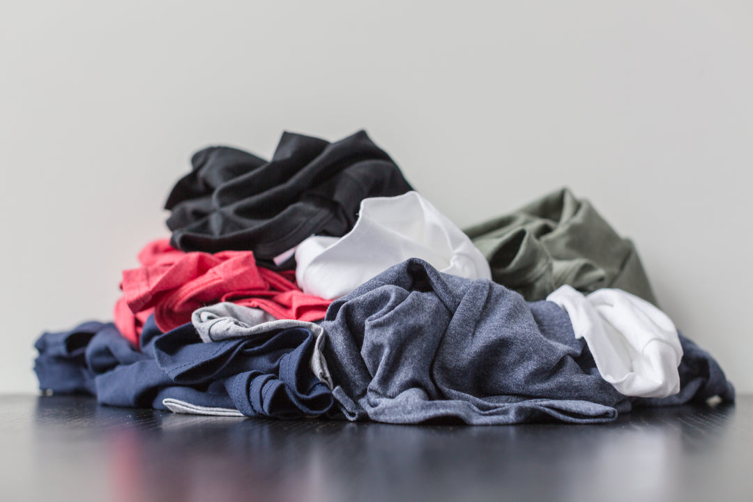 pile of laundry for machine wash and dry instructions for our merino wool products