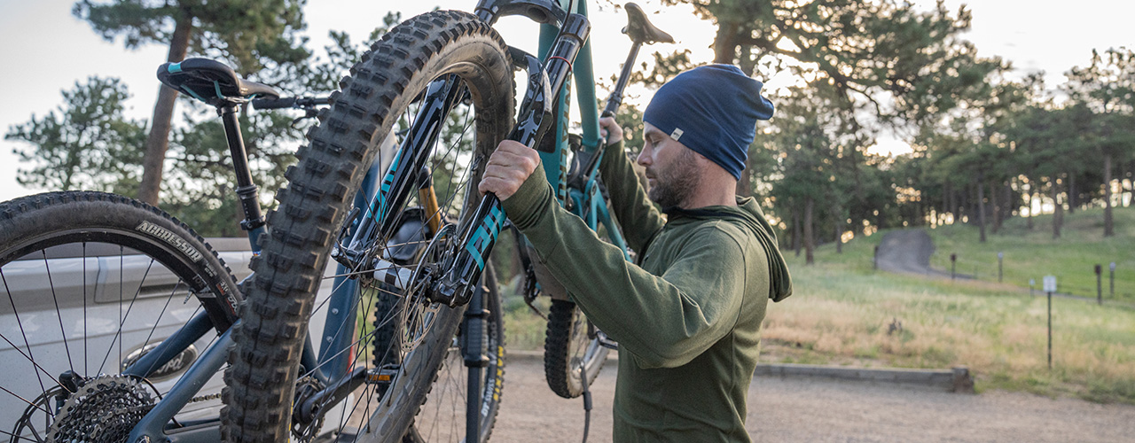 man getting ready to go biking wearing micro weight merino wool