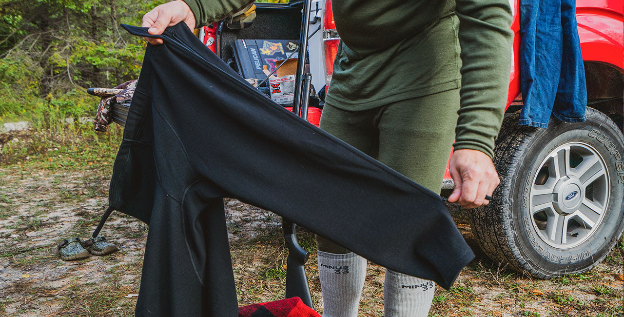 man getting ready to hunt with expedition weight zip off pants