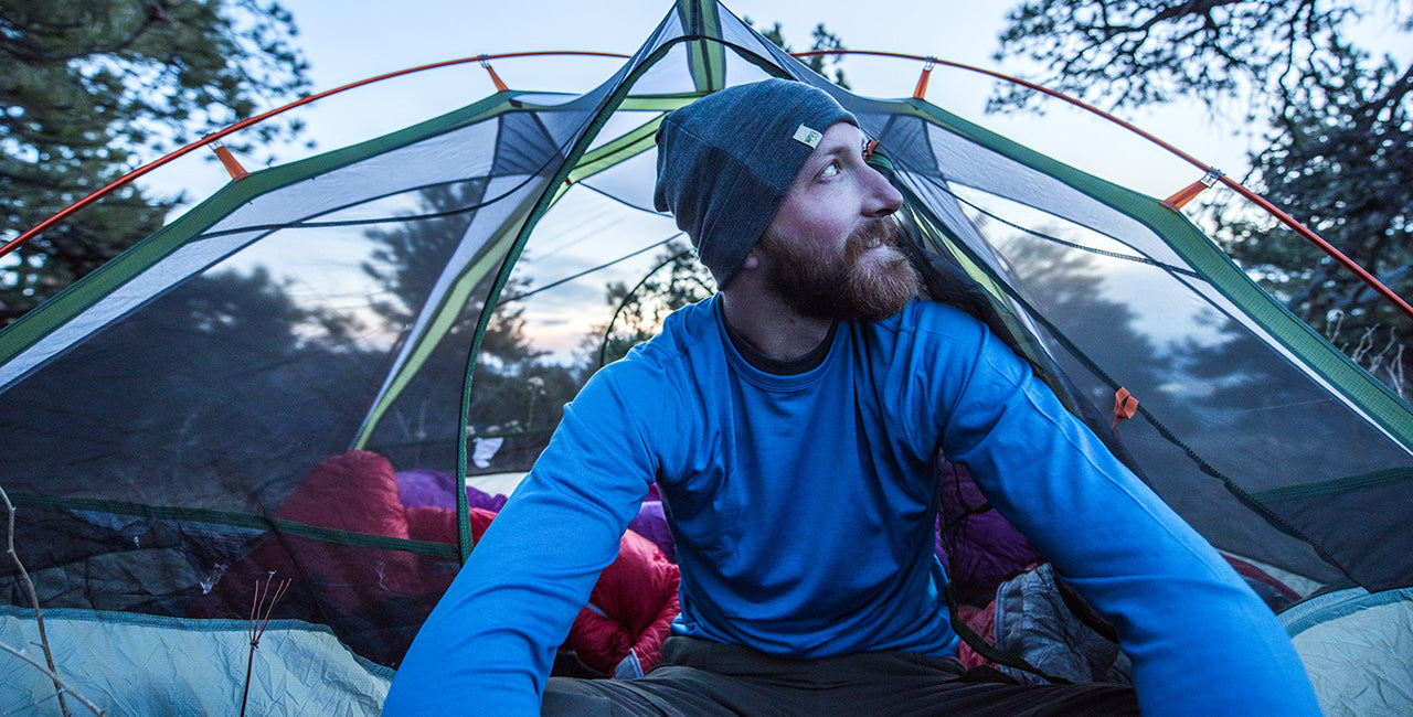man camping wearing lightweight long sleeve
