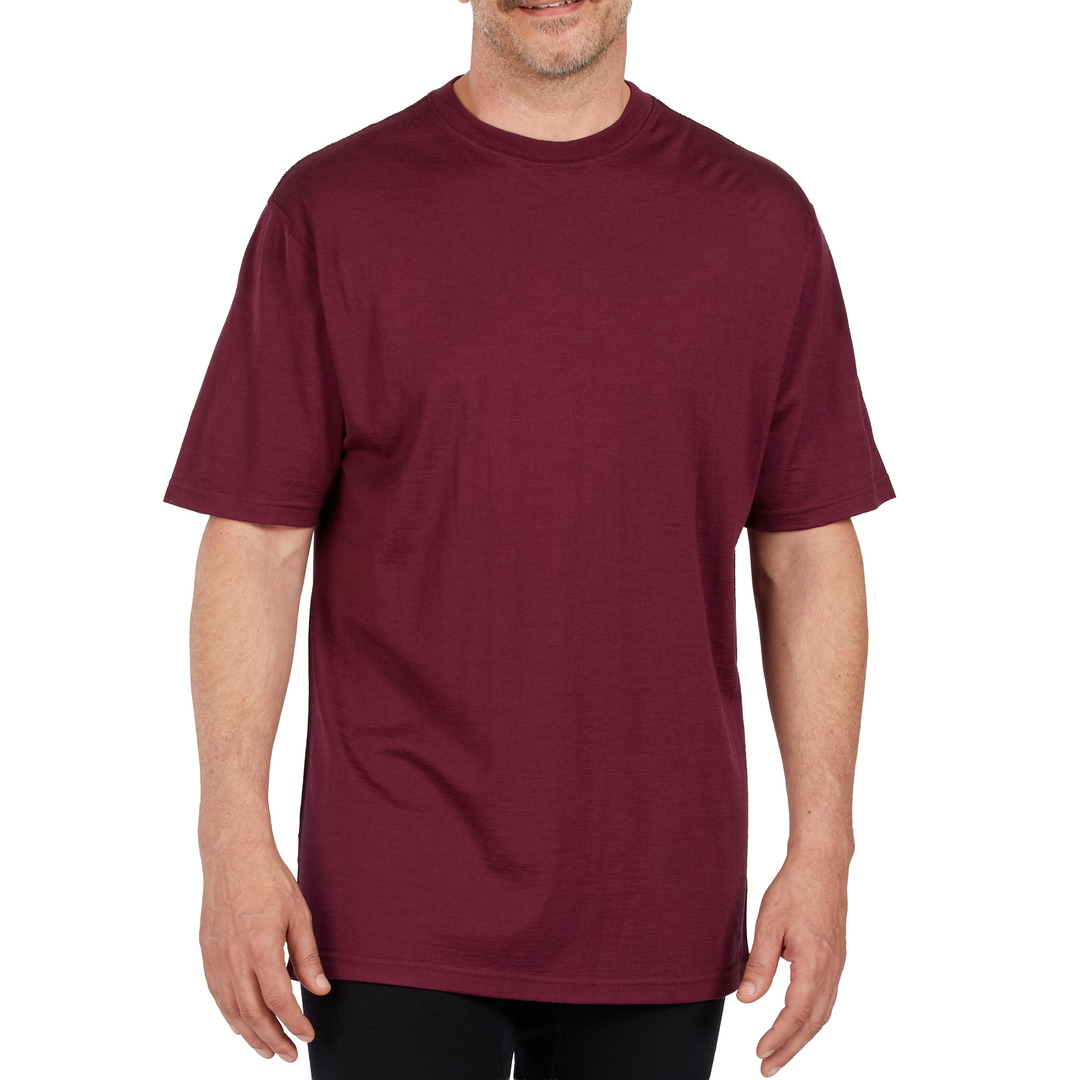 A man models a super soft, short sleeved merino wool t shirt. Use it as a base layer under your work shirt, or wear it all by itself during your next summer summit. #color_burgundy