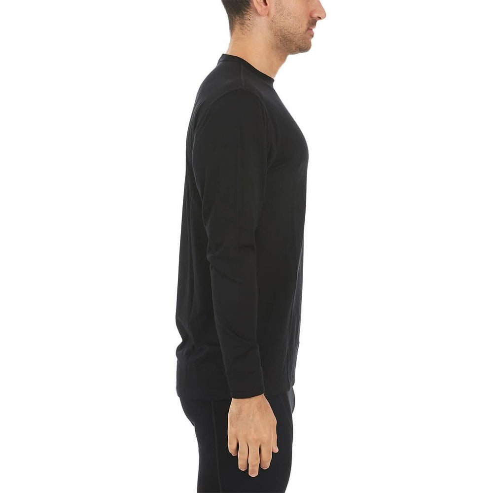 A man models the lightweight long sleeved merino wool base layer crew neck top #color_black