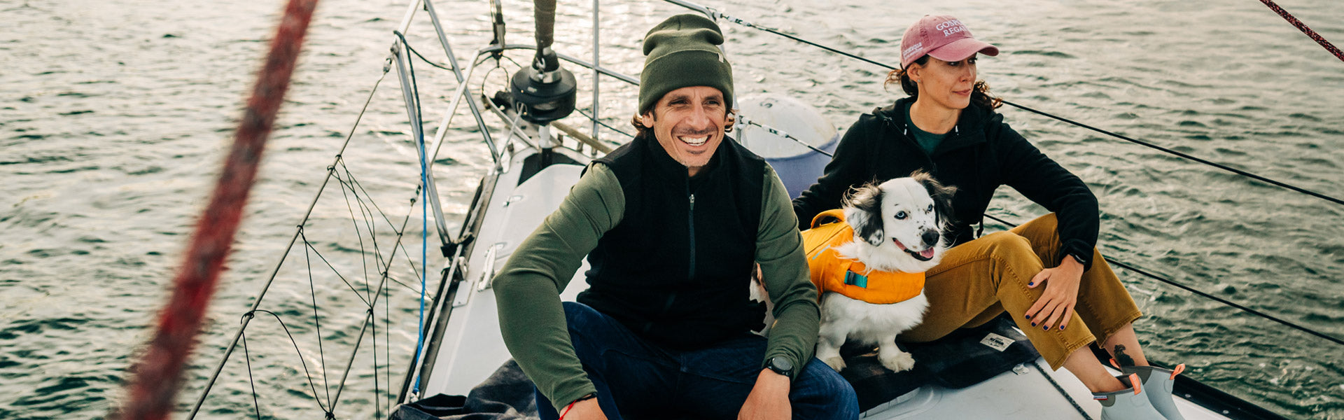 sitting on a boat in merino wool clothing. merino wool vest and thermal baselayer 